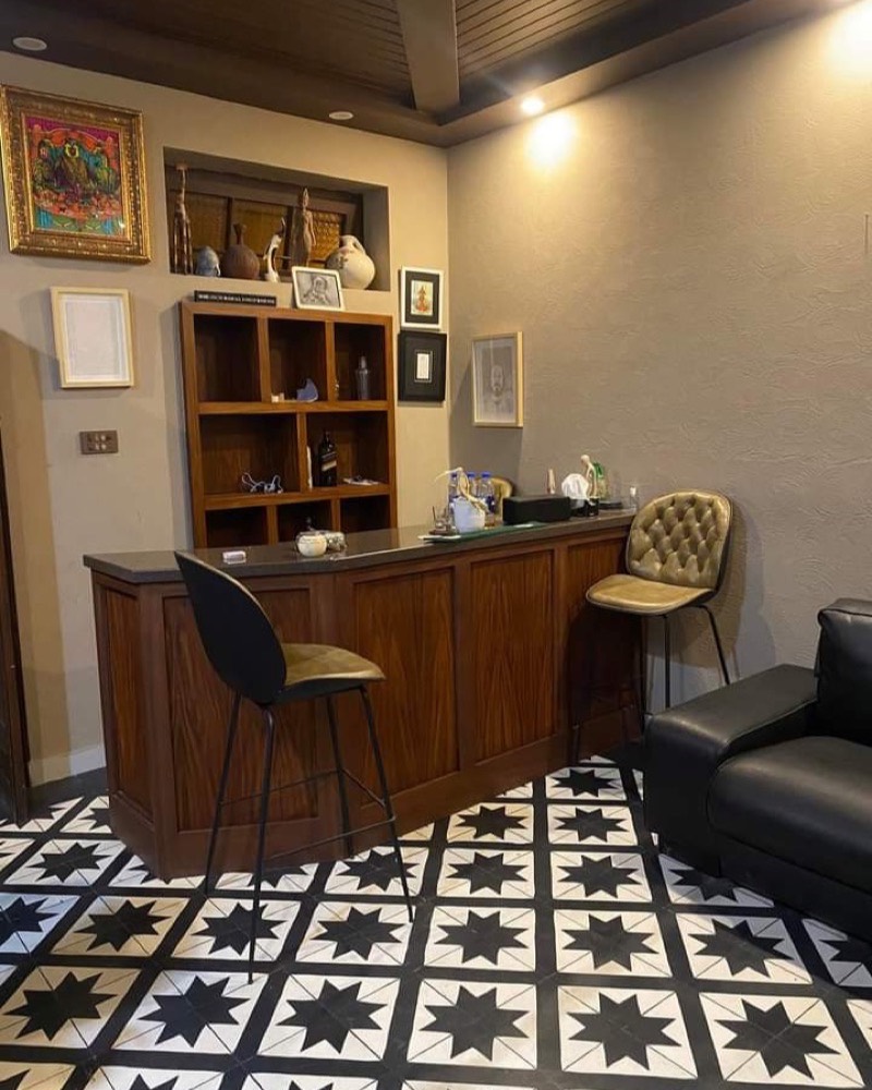 Black and white star-pattern floor in a bar interior