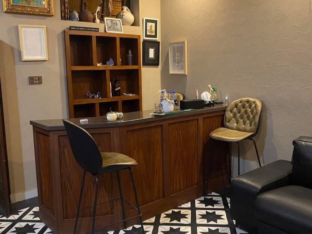 Bar interior with a black and white star-pattern tile floor